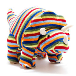 Best Years Knitted Triceratops Dinosaur Toy in Rainbow Stripes. Made From 100% acrylic yarn with recycled polyester filling in a vibrant rainbow knitted body. Featuring soft white felt claws and three matching white horns plus hand stitched eyes, a long t