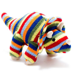 Best Years Triceratops Knitted Dinosaur Rattle in Rainbow Stripe. Made from 100% acrylic yarn with recycled polyester stuffing in a vibrant, stripey rainbow, knitted body. Featuring light brown felt toes with matching triple horns & hand stitched eyes.