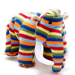 Best Years Woolley Mammoth Knitted Dinosaur Rattle in Rainbow Stripes. Made From 100% acrylic yarn with recycled polyester stuffing in a vibrant rainbow knitted body. Featuring brown felt toes and matching ears plus two impressive white curved tusks.