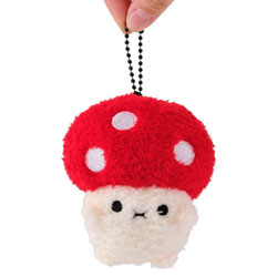 Noodoll Ricemogu Keyring. This lovely little mushroom keyring comes with a bright red cap complete with sparkling pink spots, a white furry body with little stitched eyes and mouth and is finished with a black ball keychain to attach it to whatever you li