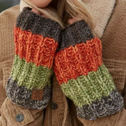 Pachamama Cotopaxi Handwarmer Earth. These Pachamama fingerless gloves are knitted in Nepal by local villagers using local wools and natural dyes to UK designs..They feature very earthy tones of brown, orange and green in thick colour bands, and they come