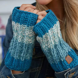 Pachamama Cotopaxi Handwarmer Teal. These Pachamama fingerless gloves are knitted in Nepal by local villagers using local wools and natural dyes to UK designs. They feature gorgeous shades of teal in thick bands and they come fleece lined.