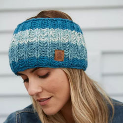 Pachamama Cotopaxi Headband Teal. These Pachamama Bobble Beanies are knitted in Nepal by local villagers using local wools and natural dyes to UK designs. Featuring thick bands of varying shades of teal. They are fleece lined for extra warmth.