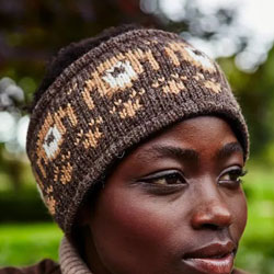 Pachamama Pooch Dog Headband Bark..These Pachamama Headband are knitted in Nepal by local villagers using local wools and natural dyes to UK designs..Each Pooch headband features a bark-brown background with a row of knitted pooch heads with a  fleece lin