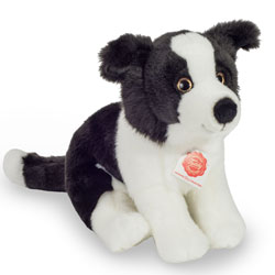 Teddy Hermann Border Collie Puppy Sitting 25cm Soft Toy. Coming in a black and white fur body with a long, white tipped tail, alert ears and big glossy eyes. It is perfectly proportioned, and comes with the most adorable cute looks.