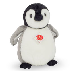 Teddy Hermann Penguin Soft Toy 24cm. Coming with a super soft, fluffy, white, grey and black fur body. Featuring a black suede beak, matching feet and cute little wings.